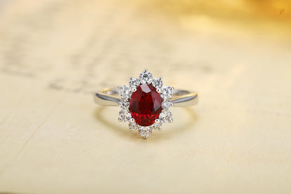 Oval Lab-Grown Ruby and Lab-Grown Diamond Starburst Halo Ring in 14k White Gold