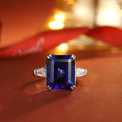 Emerald-Cut Lab-Grown Sapphire Three-Stone Ring with Tapered Baguette Lab-Grown Diamonds in 14k White Gold